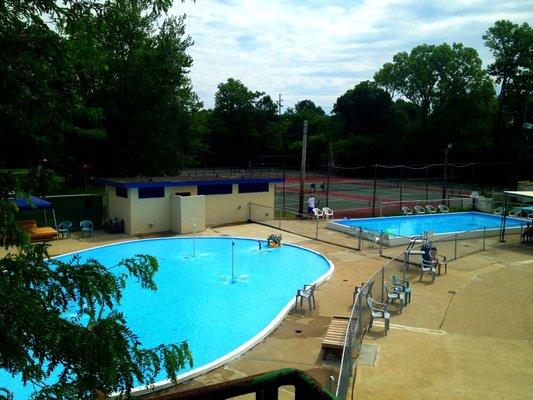 Two kids' pools and outdoor family bathroom.