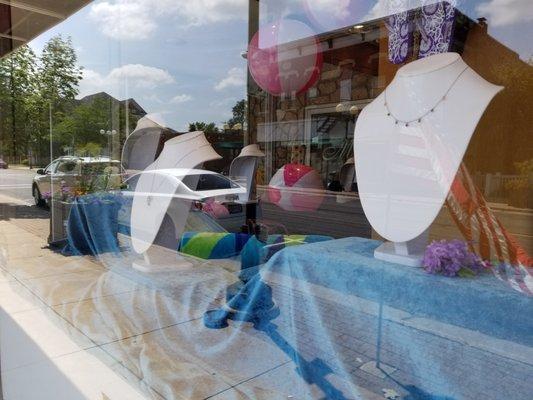 A summery window display at Mark Jewellers