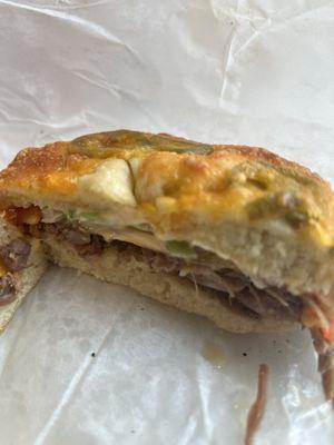 Close up - western brisket on a jalapeño cheddar bagel