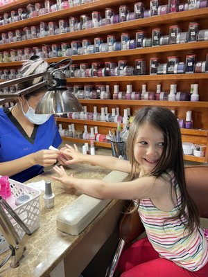 My sweet princess getting her very first full manicure with Bright Sparkle Pink polish!!!