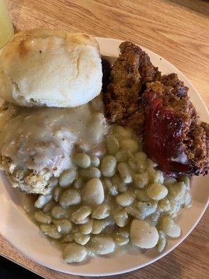 Meatloaf, Lima beans, dressing & turkey gravy, and a biscuit.