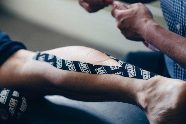 Using RockTape to aid with calf stabilization.