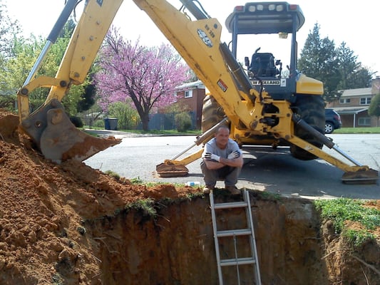 Mark working hard on a sewer repair.