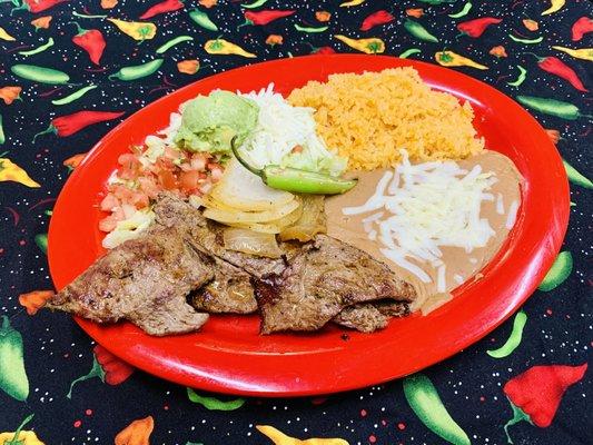 Carne Asada- grilled 8oz sirloin steak served with rice, beans and tossed salad.