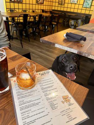 Our Labrador enjoying the AC and the occasional table snacks at Westy's