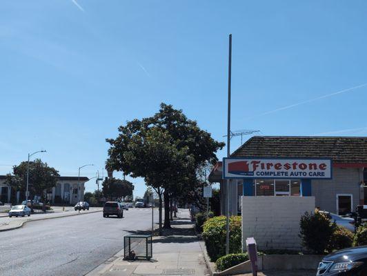 The Firestone sign as well as A portion of the street to allow viewers to get an idea of its location