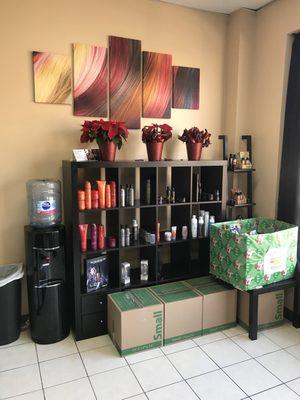 The reception area with salon products and refreshments.