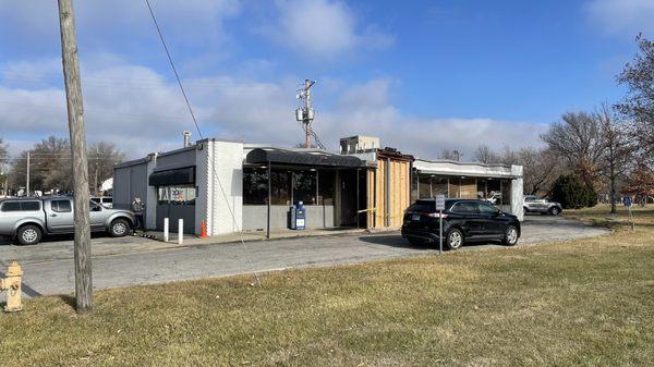 Store front with repaired entrance after a car drove into the building a few weeks ago.