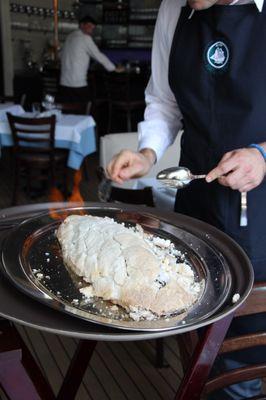 sea-salt encrusted and flambeed branzino