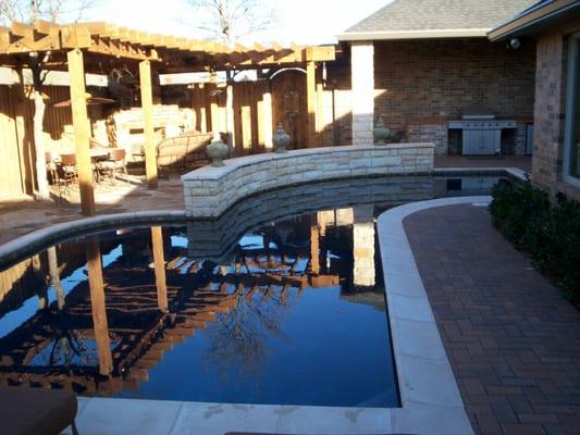 24: 14' x 33' Custom * Sheer Descent Waterfalls in Stone Wall * Black Plaster * Pavestone Deck