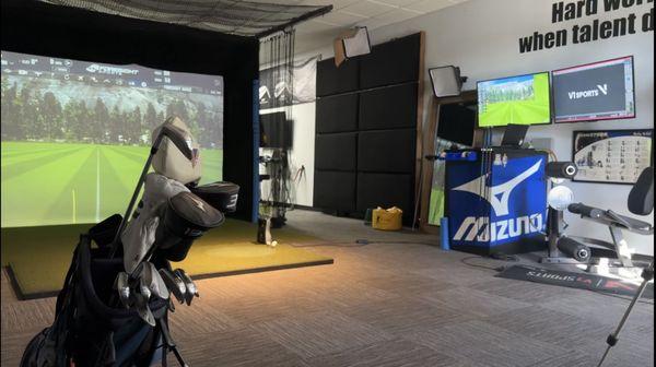 Indoor facility showcasing the swing area and simulator