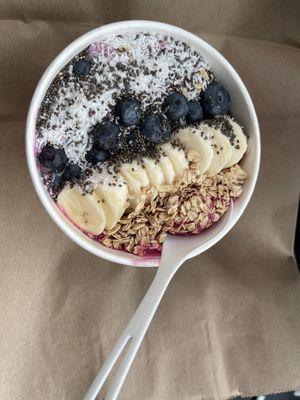 Pitaya Bowl with added coconut shreds, Chia seeds, banana, granola, and blueberries on top. Total cost was $15.91