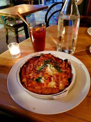 Baked risotto with added meatballs.