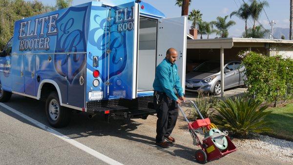 On the job! Our skilled technician is ready to tackle your plumbing challenges with Elite Rooter