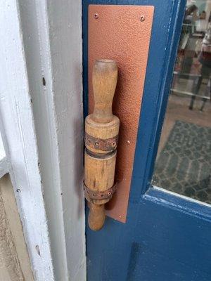 Adorable touches start at the front door with this rolling pin handle.