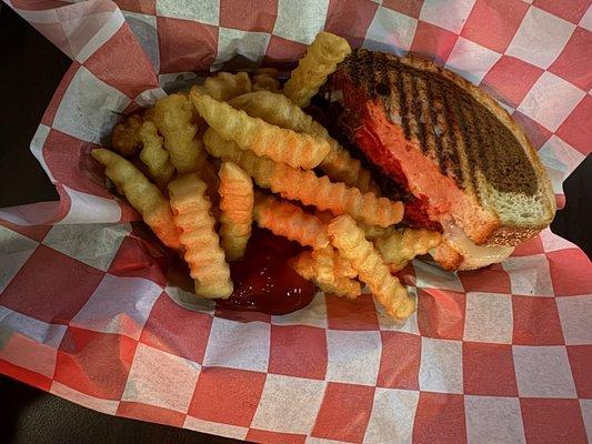 Amazing pastrami on marble rye with crispy crinkle fries.