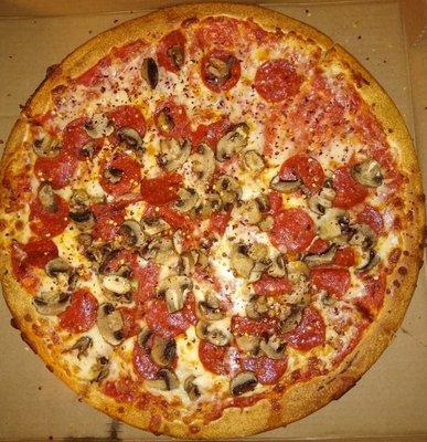 Large pepperoni and mushrooms pizza.