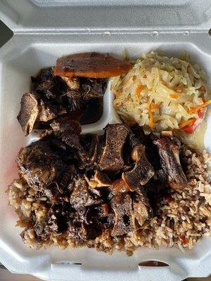 Oxtail with rice, beans and cabbage