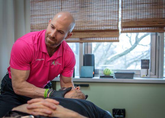 Dr. Ackerman performing a gentle upper cervical spine adjustment.