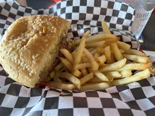 half of a half pound burger and fries