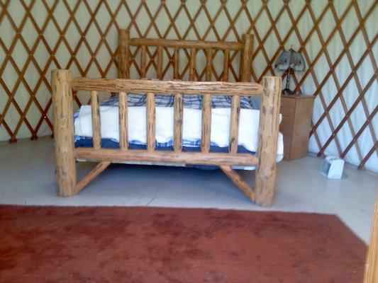 Enjoy a king size bed on the Yurt.