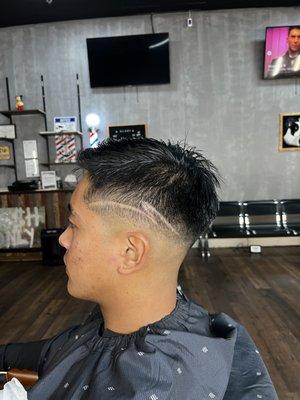 Mid to high skin fade with a simple design Cut by David  IG: vufades  Text for appointment: (619) 642-8550