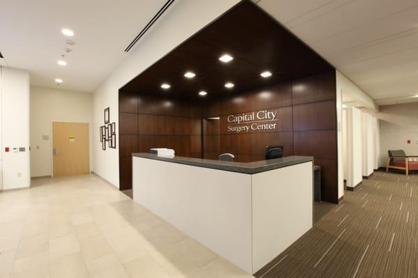 First view when walking through the doors, receptionist/check-in desk.