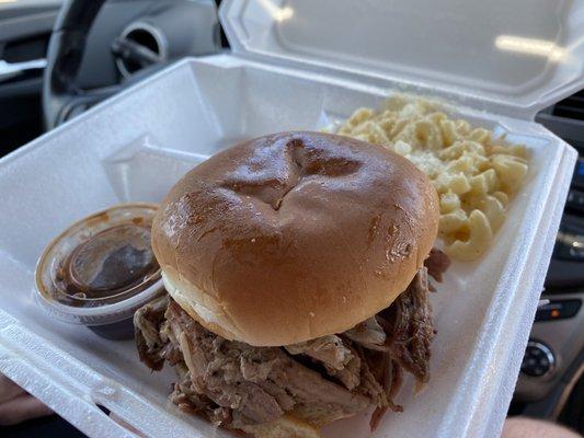 Pulled pork sandwich with side of Mac n cheese.