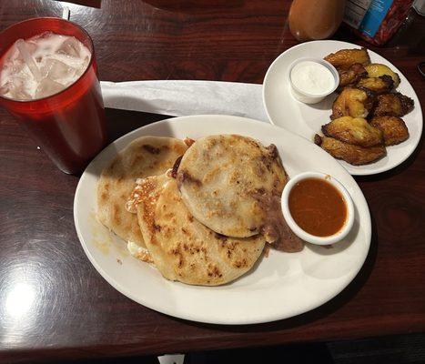 horchata drink, 2 cheese pupusa, 1 bean and cheese pupusa, and a side dish of fried plantains