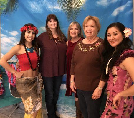 Hawaiian Luau for office Christmas Party with hula dancers from Pacific Islanders.