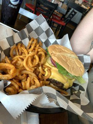 A whole pound burger with everything on it.