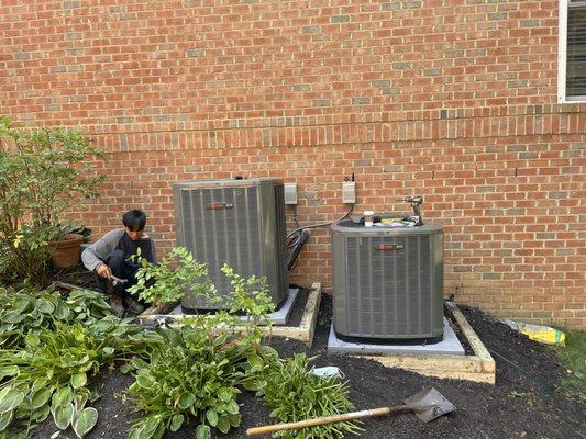 Trane 5 and 3-ton HVAC systems successfully installed with a newly constructed retaining wall.