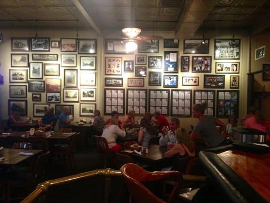 High, old tin ceilings & Texas memorabilia line the dining room walls...