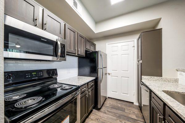 Kitchen area at Riverhill Apartments in Grand Prairie, Texas