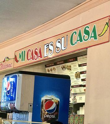 Their motto is hung inside over the soda machine and ordering area