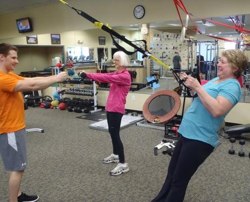 Our other expert trainer doing a group personal training session with two very dedicated clients