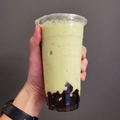 Avocado smoothie with boba.