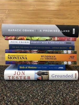 9 of the 2020 Top 10 bestsellers! Lots of local books in this stack!