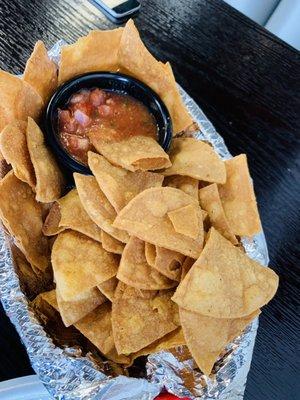 Homemade tortilla chips and house salsa