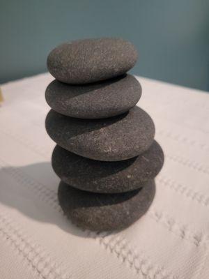 Hot stones help melt the stress away.  Try them cold to help alleviate headaches