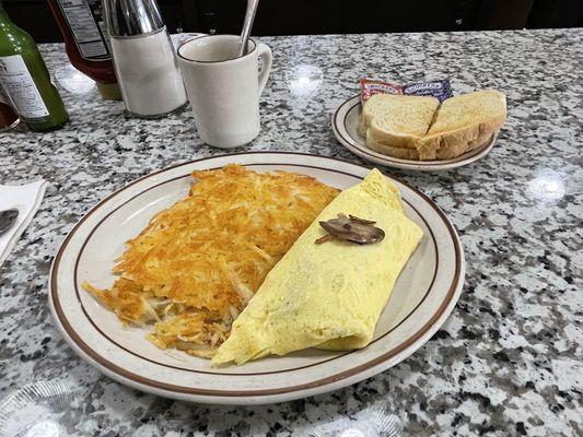 Veggie omelet with hashbrowns and sourdough toast.