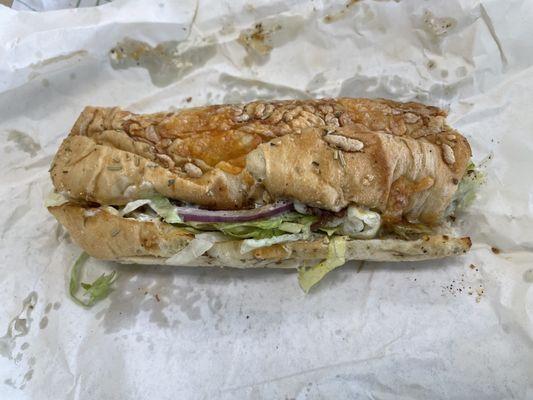 What my 1/2 steak sub looked like when I opened it in the seating are immediately after it was handed to me. $8 for this ...