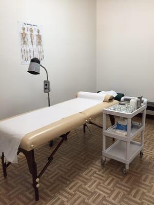 Treatment room for acupuncture, cupping, and traditional herbal topical paste.