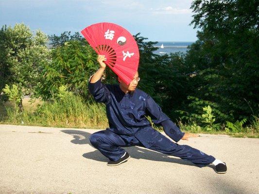 Dr Louis practicing Tai Chi Fan