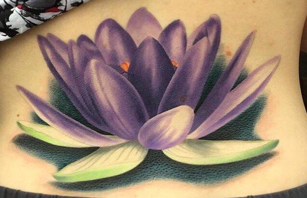 Large lower back lotus piece by Jesse. 3 sessions, 3-4 hours each.