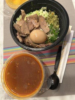 Spicy Beef Ramen takeout. Plenty of beef and noodles. Broth was at spicy.