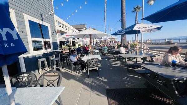 Outdoor seating area with view of ocean