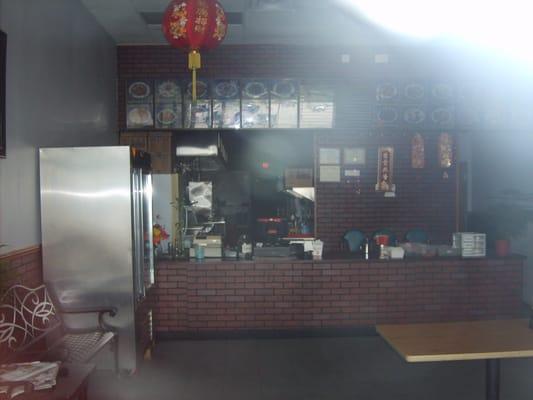 Photo through the window, before they were open for lunch. That's why it looks dark.