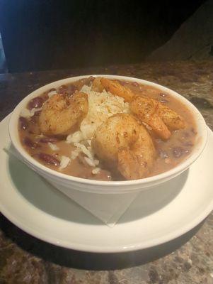 The Cajun: Four spicy shrimp served over rice in house made slow cooked spiced red beans.