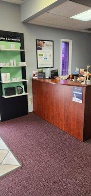 Reception desk next to hearing health care products